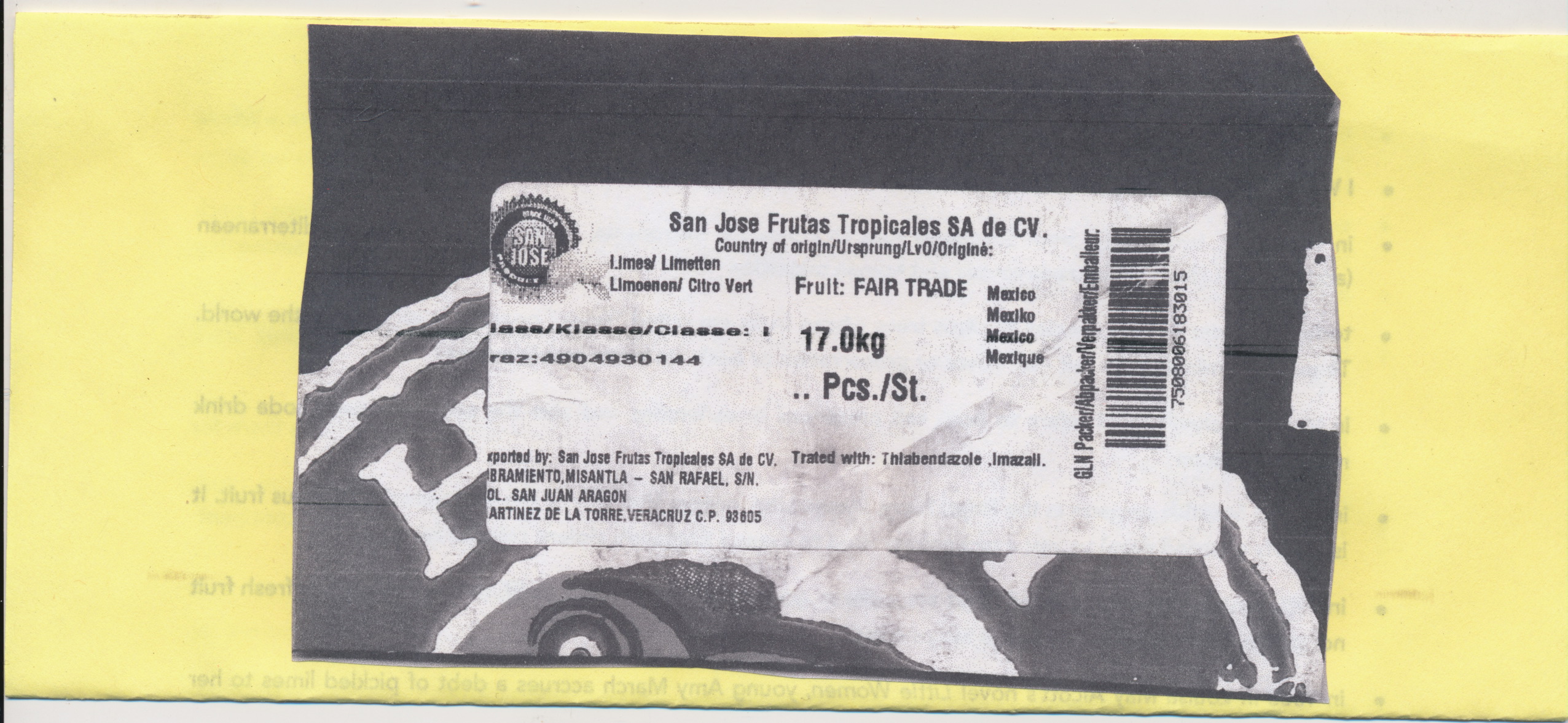 A black and white Xerox of the shipping label for limes on a pale yellow background; the text reads "San Juan Frutes Tropicales; Fair Trade; Mexico," from Veracruz.